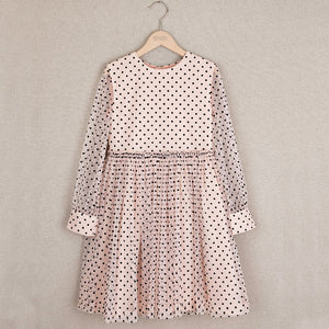 Long sleeve cream dress with polka dots and transparent sleeves