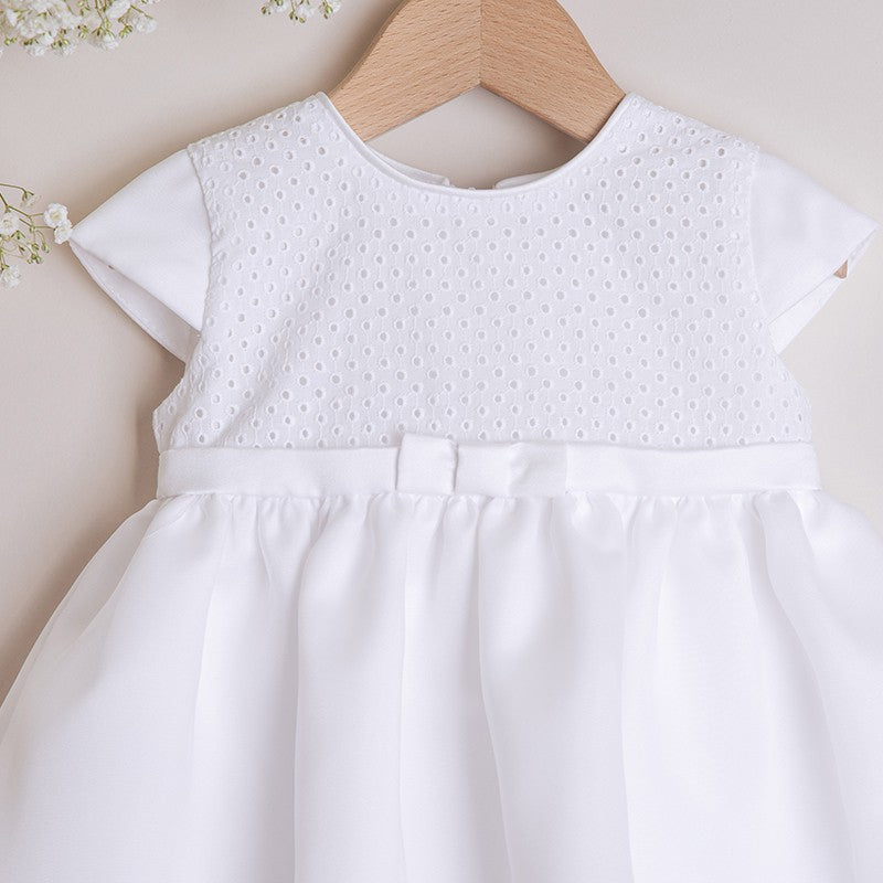 White dress with embroidered material